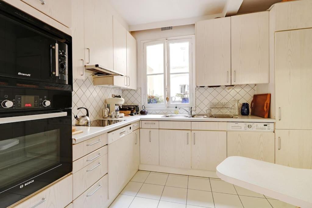 Apartamento Sejour Au Pied De La Tour Eiffel París Exterior foto